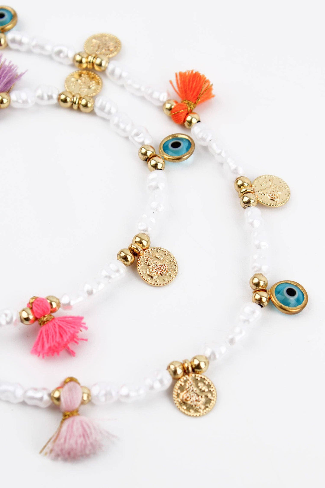 PEARL CHARM AND TASSEL NECKLACE