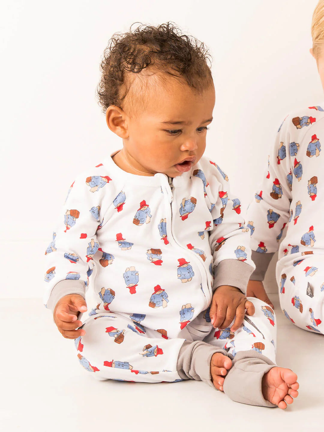 PADDINGTON LOVES TO TRAVEL ZIP UP ROMPER