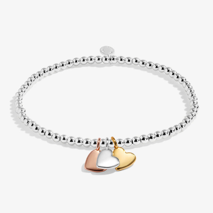 A LITTLE CHARMED MOMENTS HEART OF GOLD BRACELET