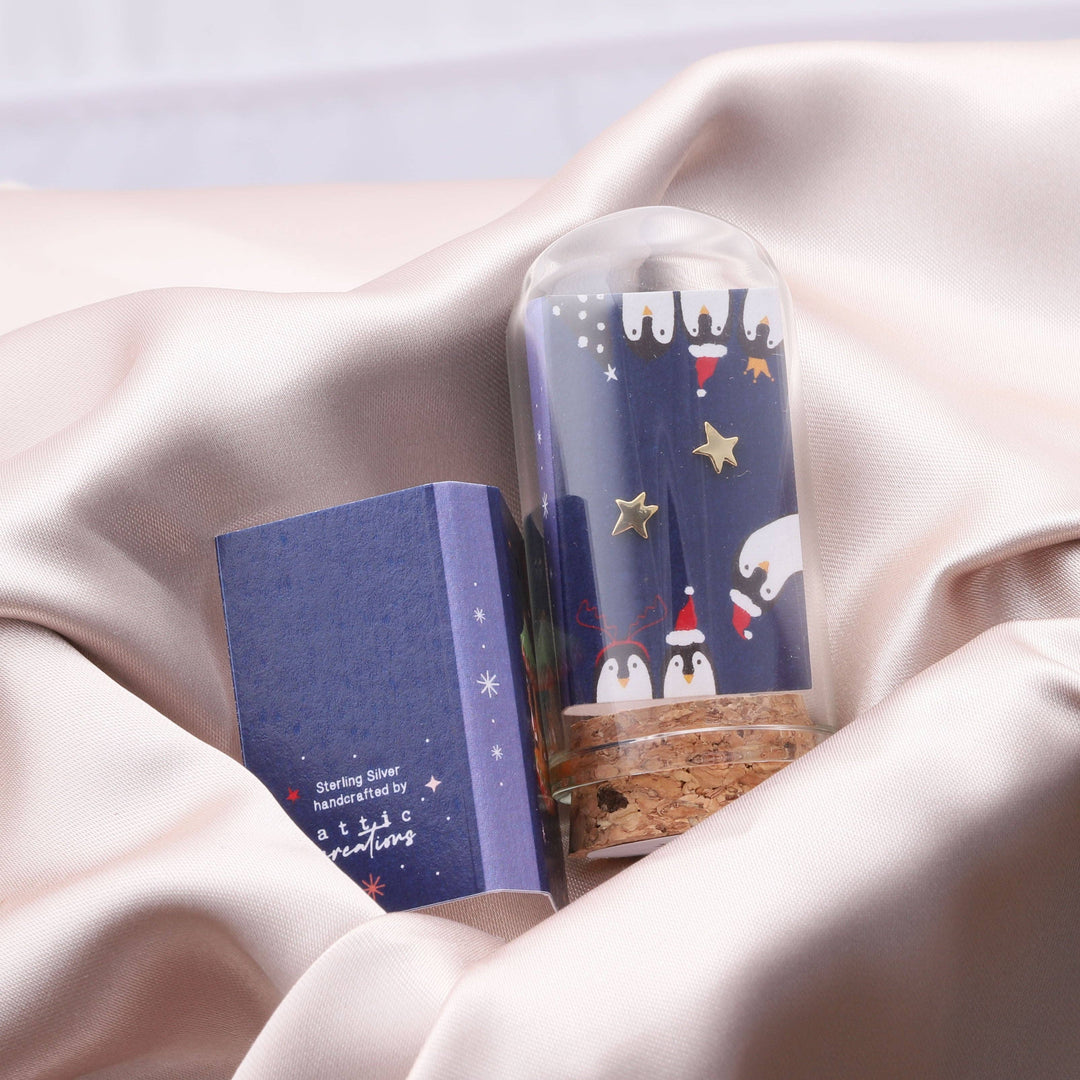 XT013 Gold Star Earrings with penguin graphic